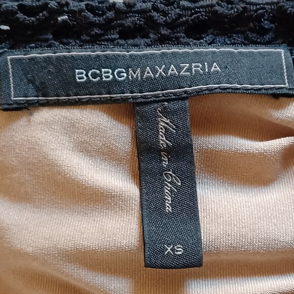 EUC BCBGMaxAzria "Vicktoria" Mixed-Knit Black Peplum Top Size XS - Picture 8 of 11